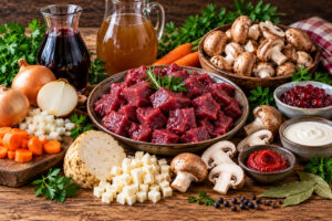 Zutaten für Rehgulasch mit Rotwein, Champignons und Wildgewürz